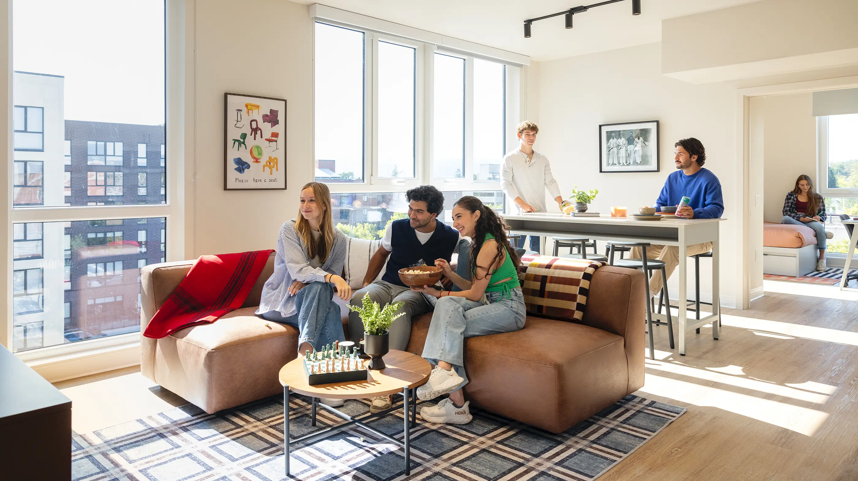 a group of friends sitting in a living room