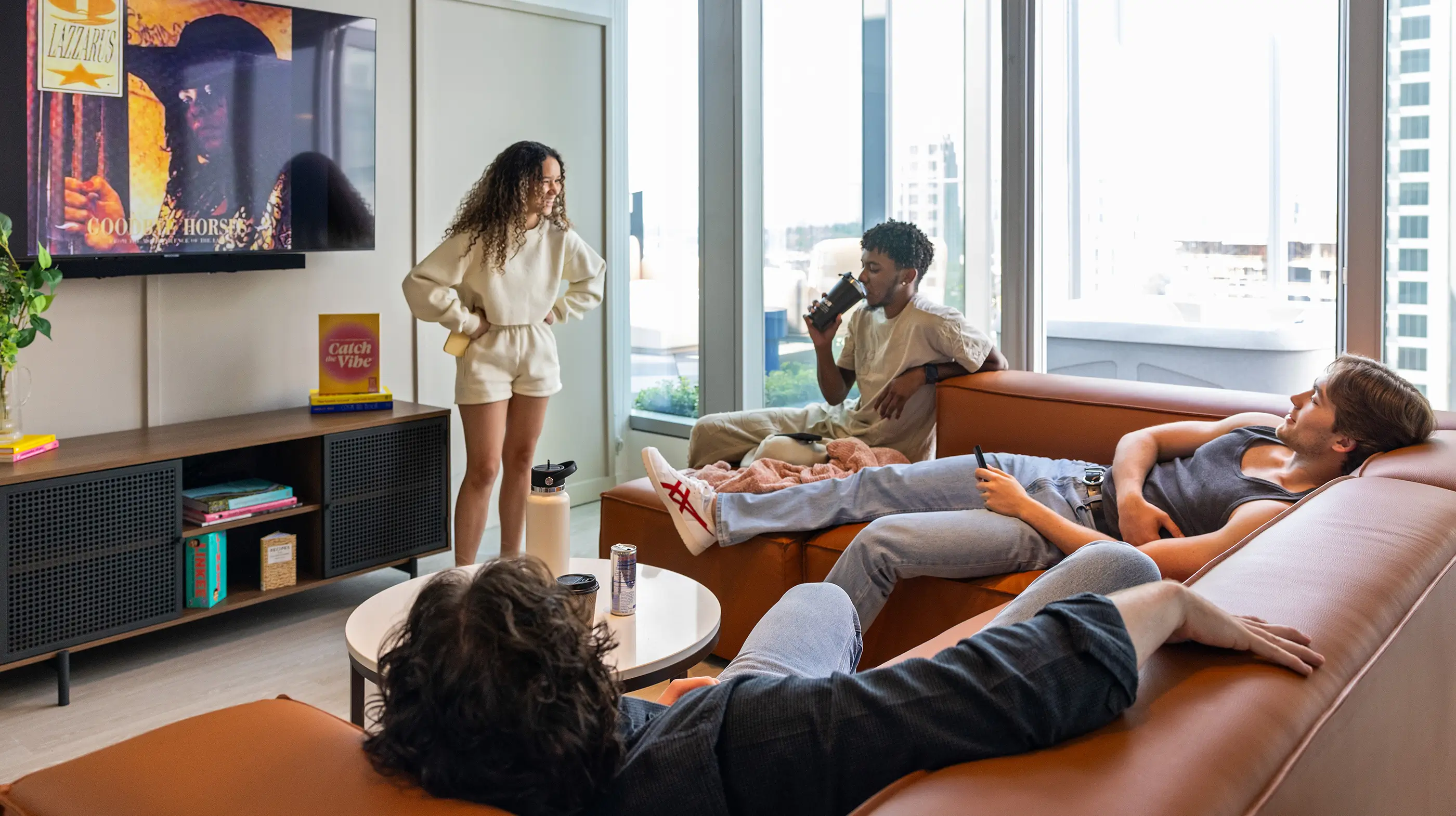 a group of friends hanging out in a living room