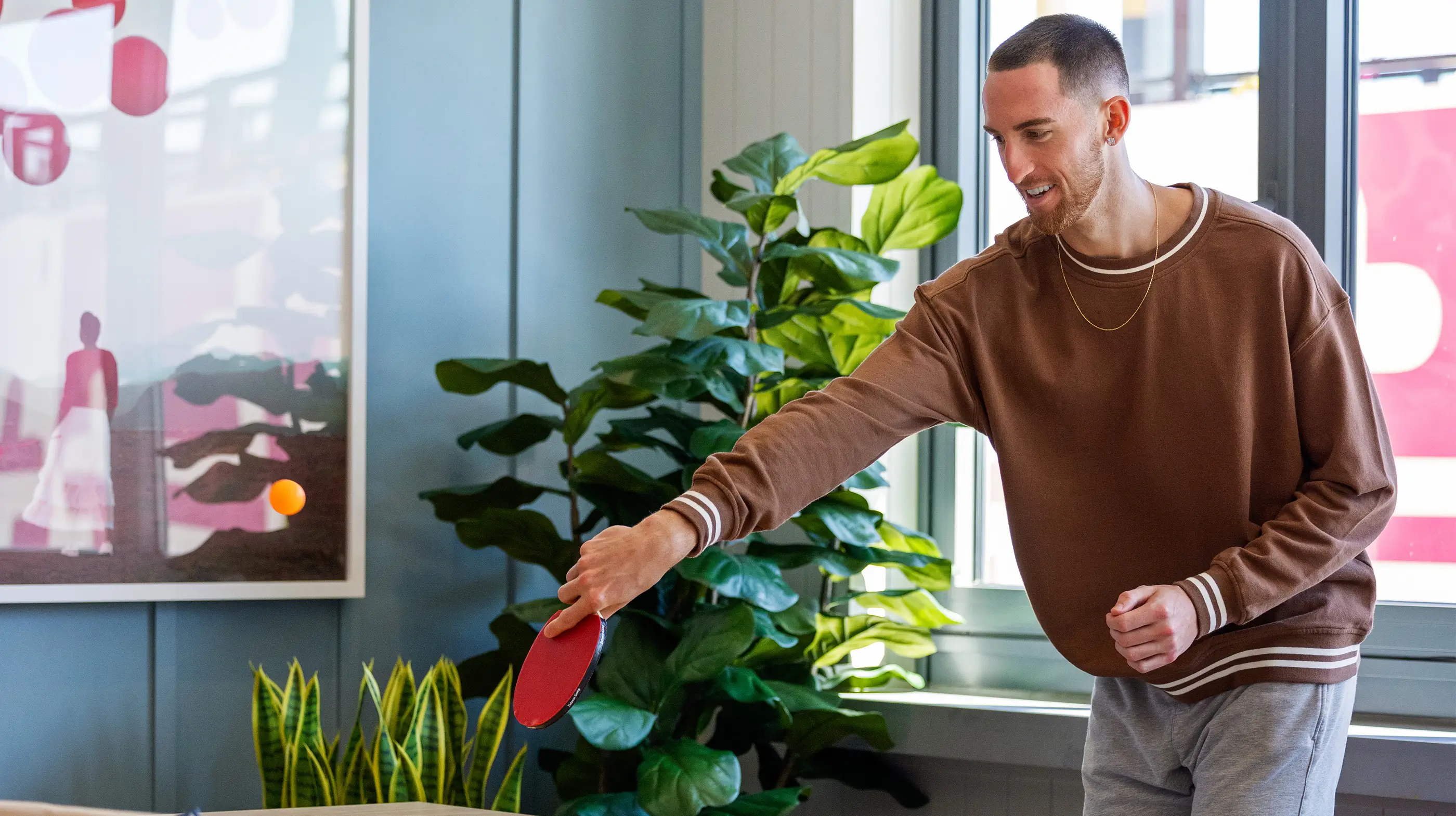 a man playing table tennis